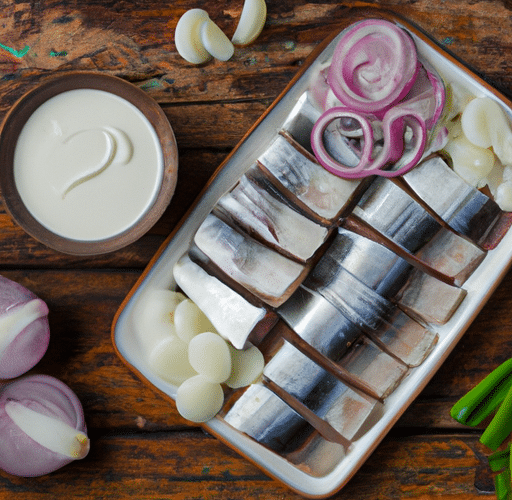 Przepis na pyszne śledzie w śmietanie z cebulą – prosty i smakowity sposób na przygotowanie tego klasycznego dania